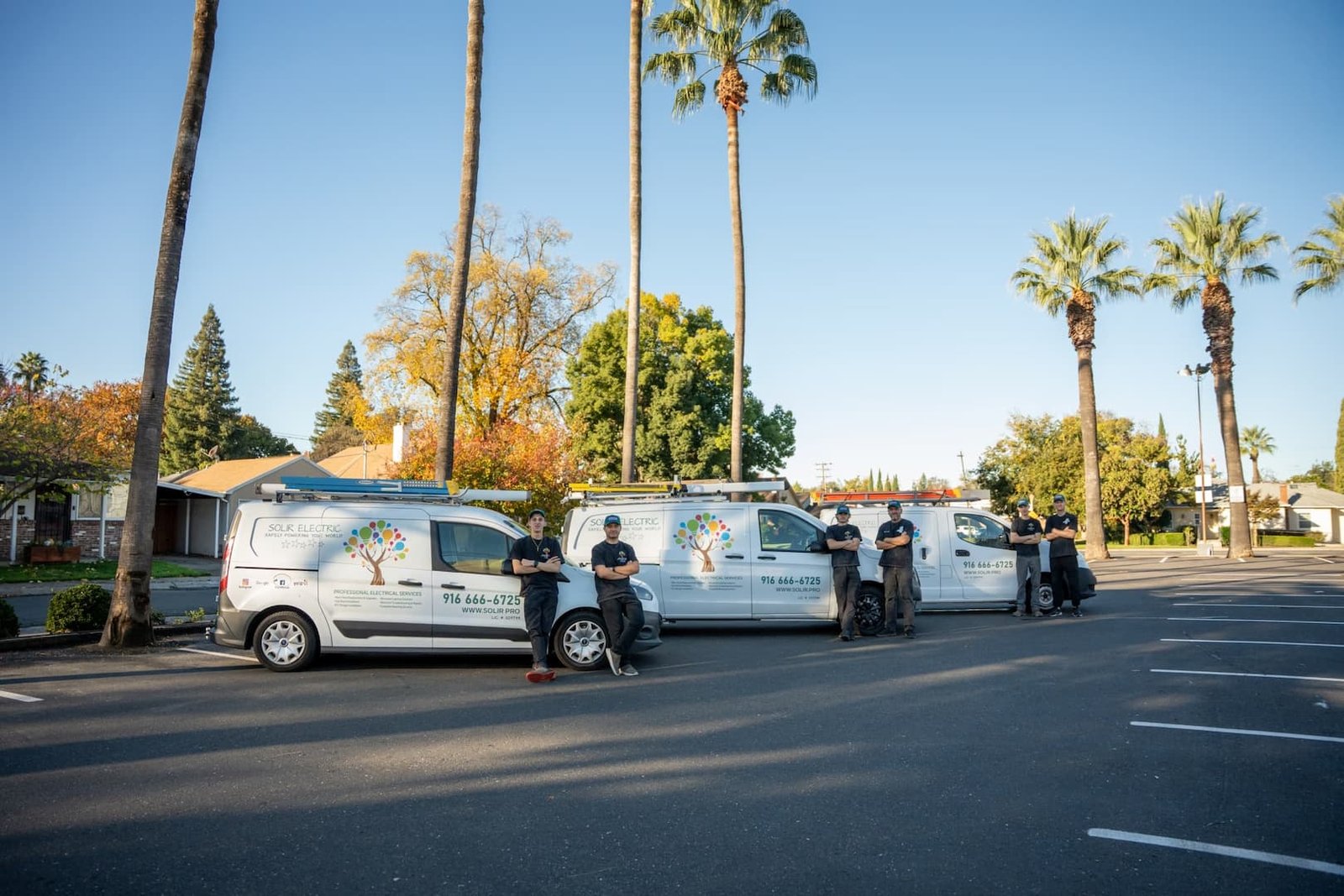 Solir Electric 9 Solir Electric service vans and team members on a palm-lined Sacramento street