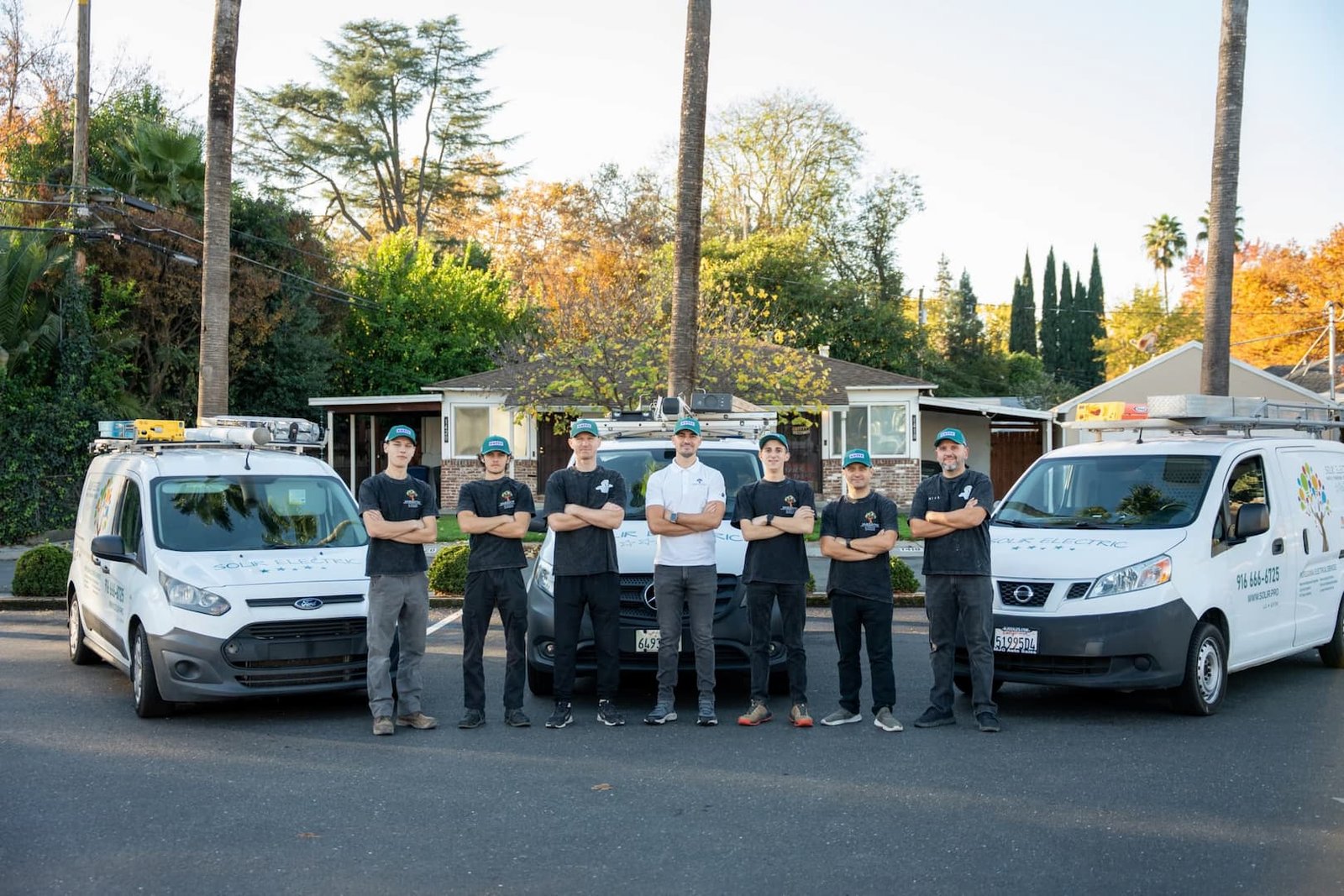 Solir Electric 8 Solir Electric team standing between branded service vans in Sacramento