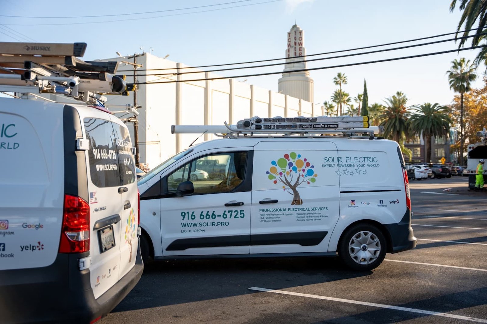 Industrial Electrical Services in Sacramento 2 Side view of a Solir Electric service van with a roof ladder and company branding